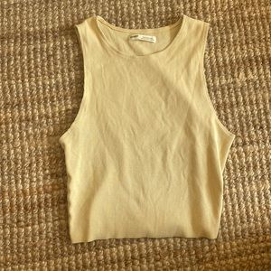 Large (but I wear a small) fits loose but good. Light yellow Pull & Bear